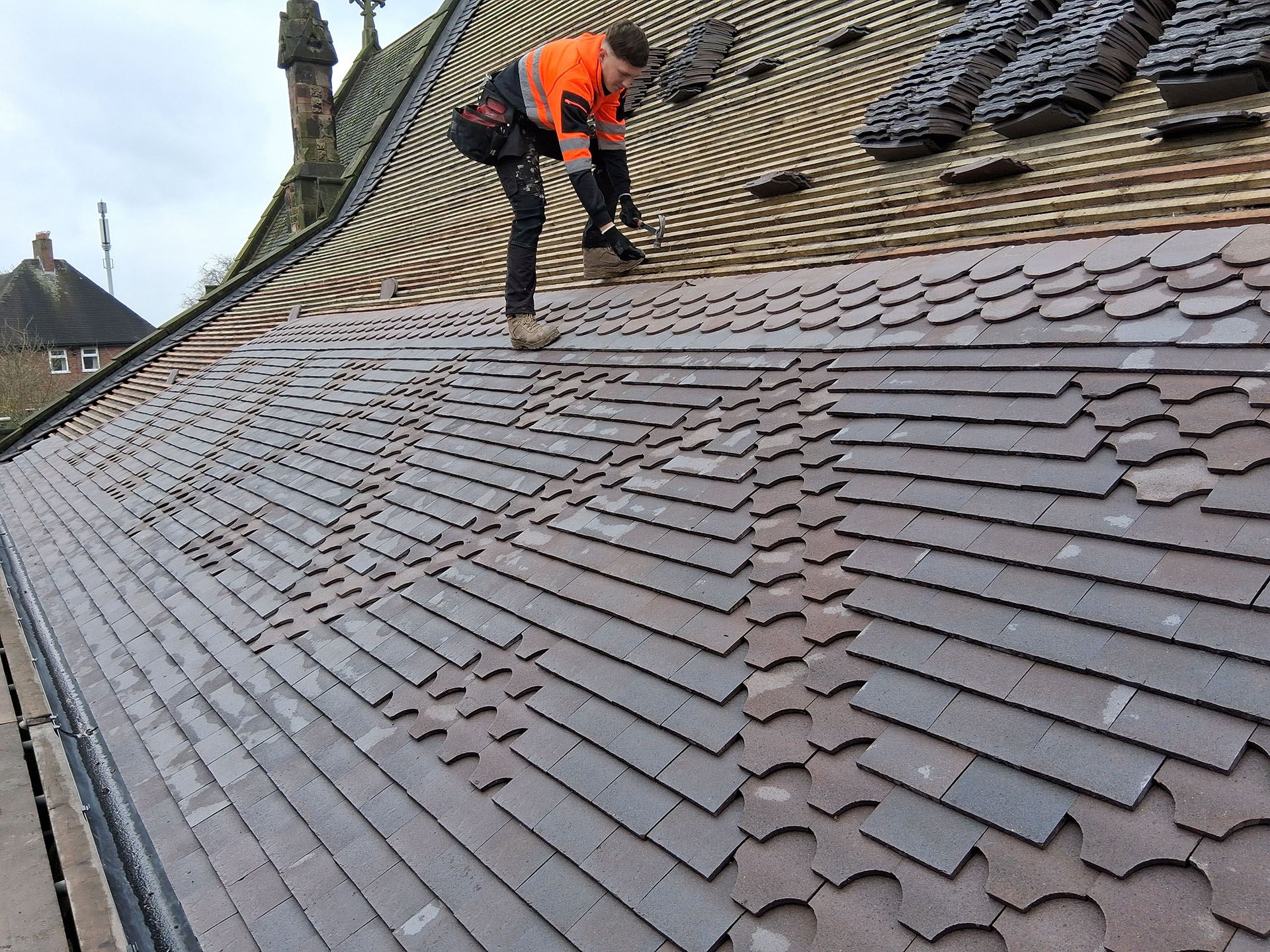 laying new Dreadnought tiles at St Marys Knutton